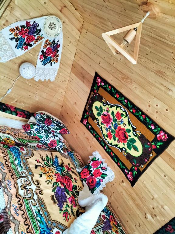 a group of ties sitting on the floor at A frame Sima in Breb