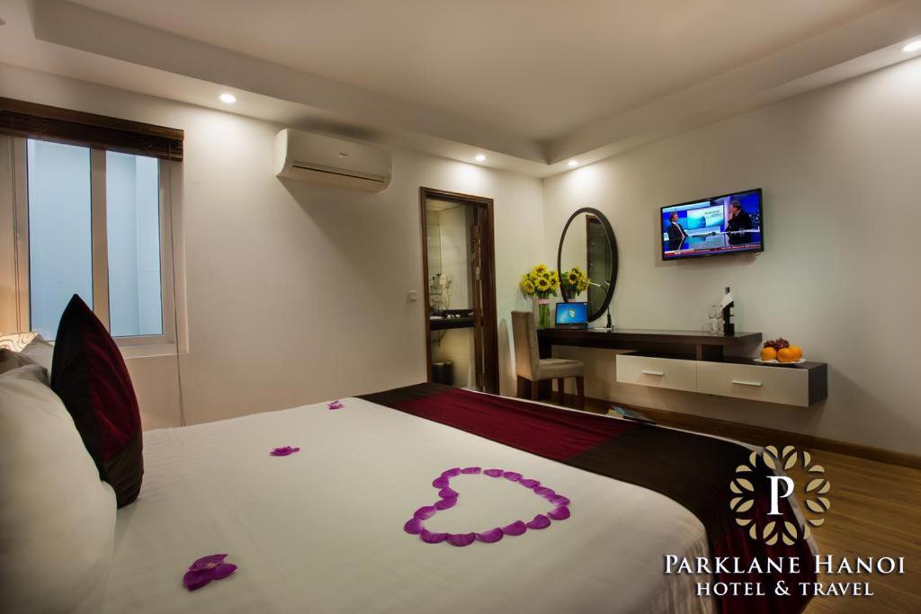 TV a/nebo společenská místnost v ubytování Parklane Central Hanoi Hotel