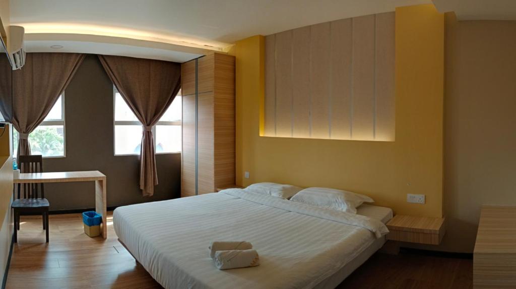 Postel nebo postele na pokoji v ubytování TOWERMAS HOTEL
