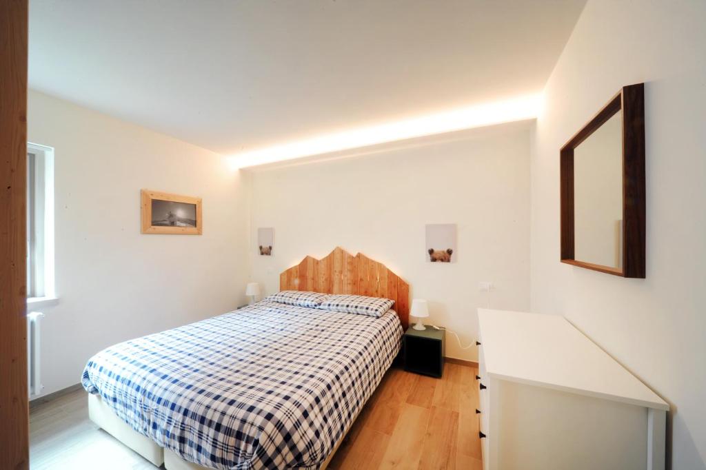 Postel nebo postele na pokoji v ubytování Appartamenti Residence Lares Ossana