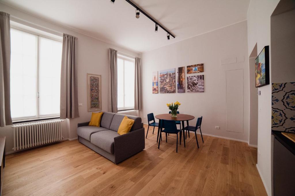 a living room with a couch and a table at Rolli Dream in Genova