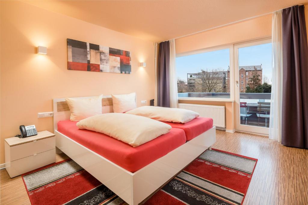 Postel nebo postele na pokoji v ubytování Hotel Am Gottesauer Schloss