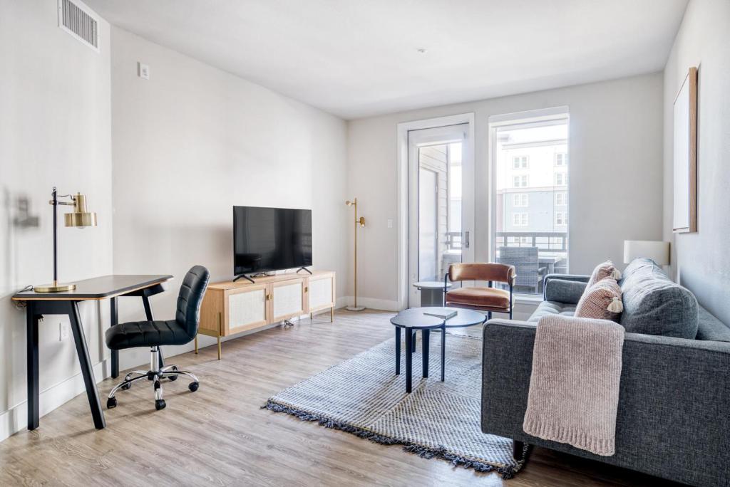 a living room with a couch and a table at Redwood City 2BR w Gym Parking nr Caltrain SFO-607 in Redwood City