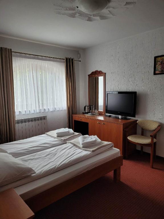 Postel nebo postele na pokoji v ubytování U Juhasa Miętówka