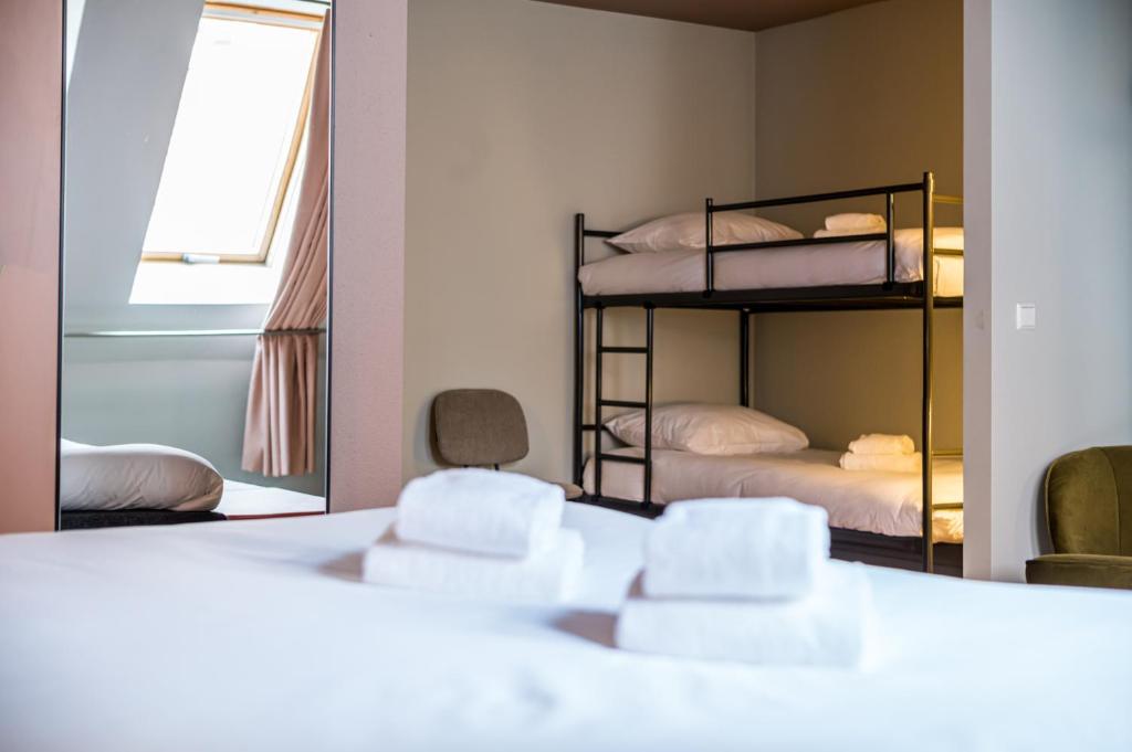 Postel nebo postele na pokoji v ubytování Hotel Halbert