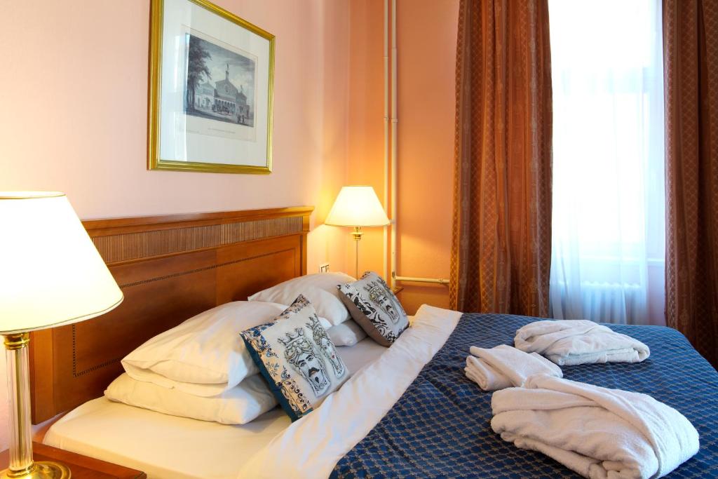 Postel nebo postele na pokoji v ubytování Hotel Villa Lauretta