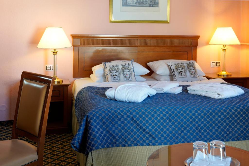 Postel nebo postele na pokoji v ubytování Hotel Villa Lauretta