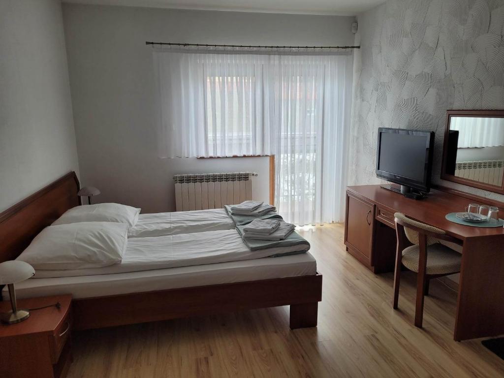 Postel nebo postele na pokoji v ubytování U Juhasa Miętówka