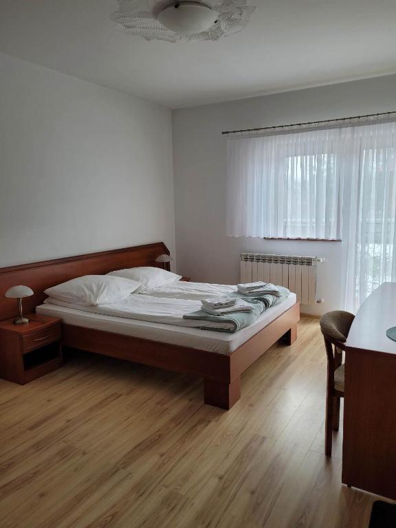 Postel nebo postele na pokoji v ubytování U Juhasa Miętówka