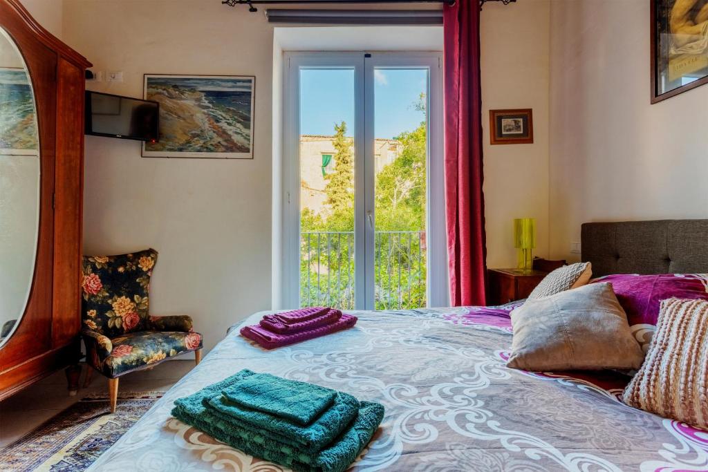 Posteľ alebo postele v izbe v ubytovaní Arimatea Casa Vacanza
