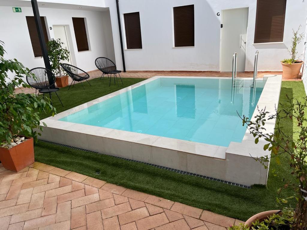a swimming pool in the yard of a house at CASIVERDE APARTAMENTO in Córdoba