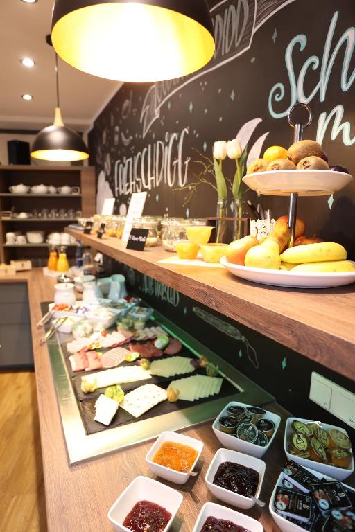 a buffet line with different types of food on display at Pension Alte Scheune in Melsungen