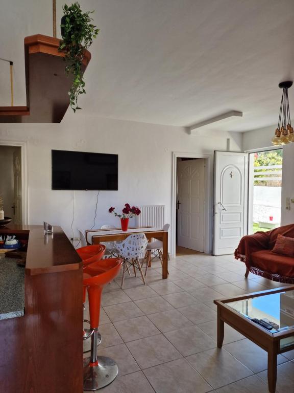 A television and/or entertainment centre at Maria's Apartments
