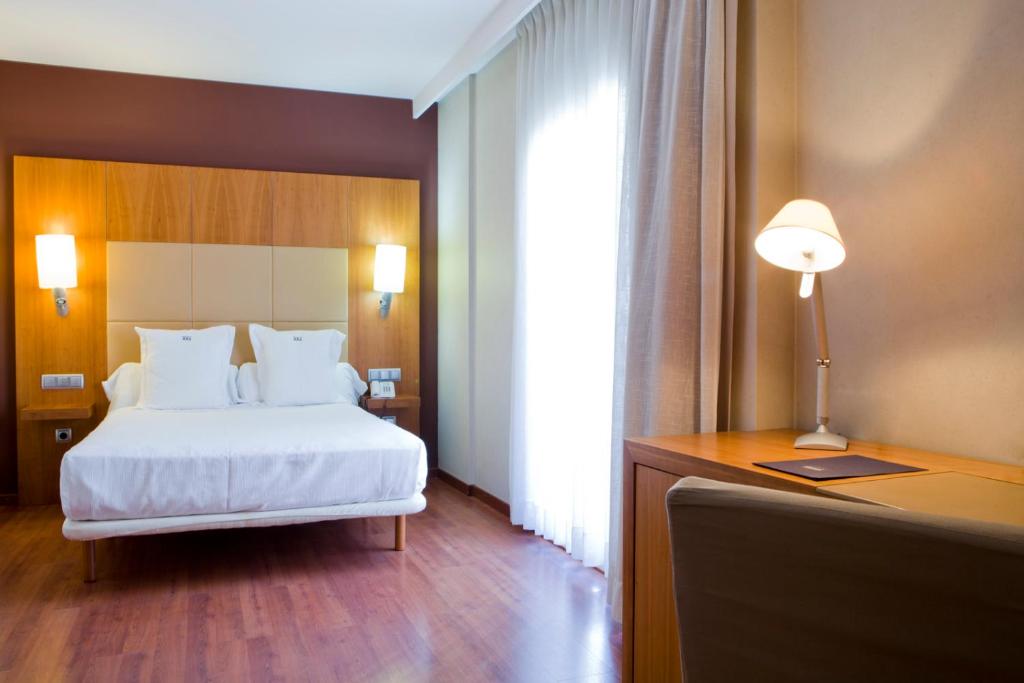 Postel nebo postele na pokoji v ubytování Num Hotel