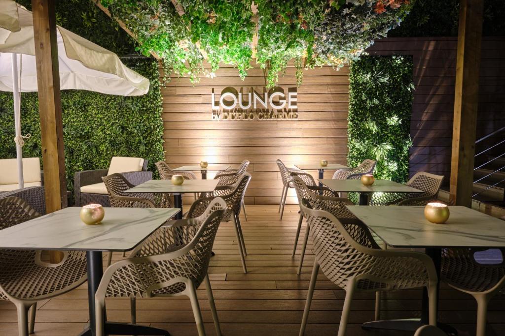 a restaurant with tables and chairs and a sign that reads lunch at Duplo Charme Boutique Hotel in Lisbon