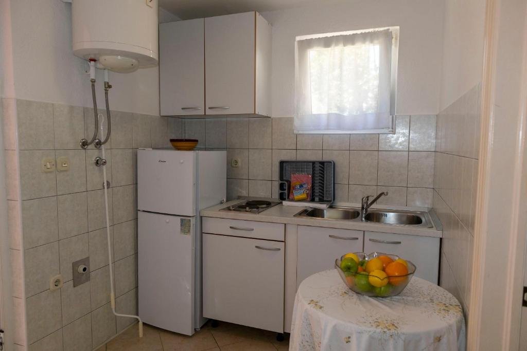 Kuchyň nebo kuchyňský kout v ubytování Apartments Ante