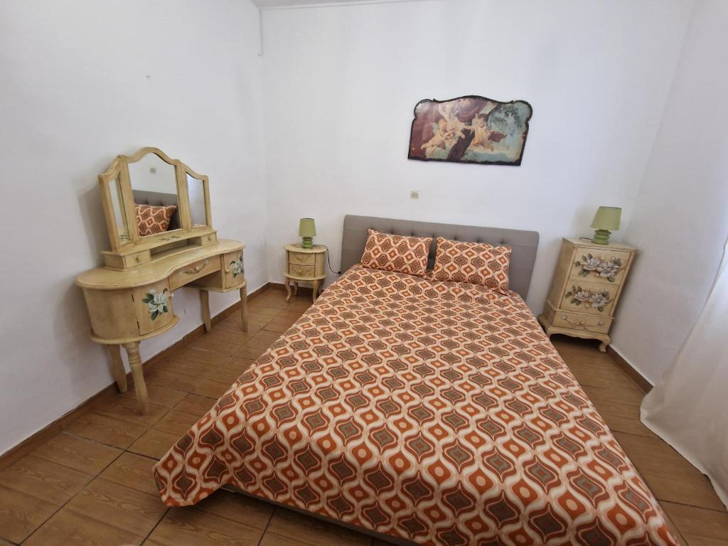 A bed or beds in a room at Maria's Apartments