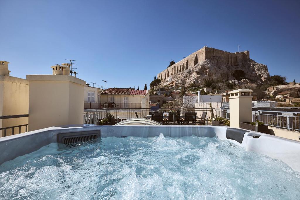 a hot tub on the roof of a building at Plaka's Villa with Breathtaking Acropolis view in Athens