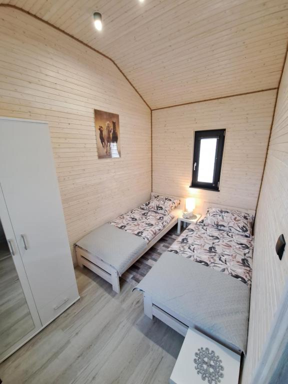 Postel nebo postele na pokoji v ubytování Domek AlMar
