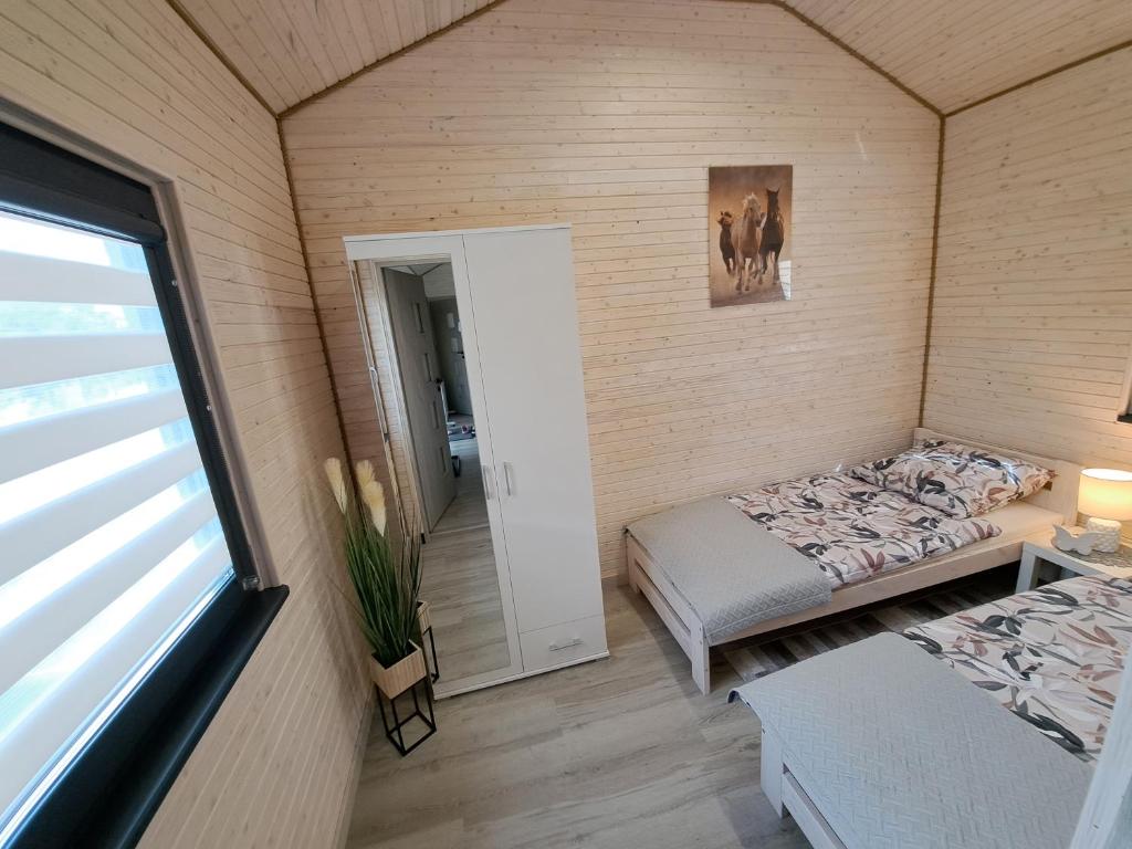 Postel nebo postele na pokoji v ubytování Domek AlMar