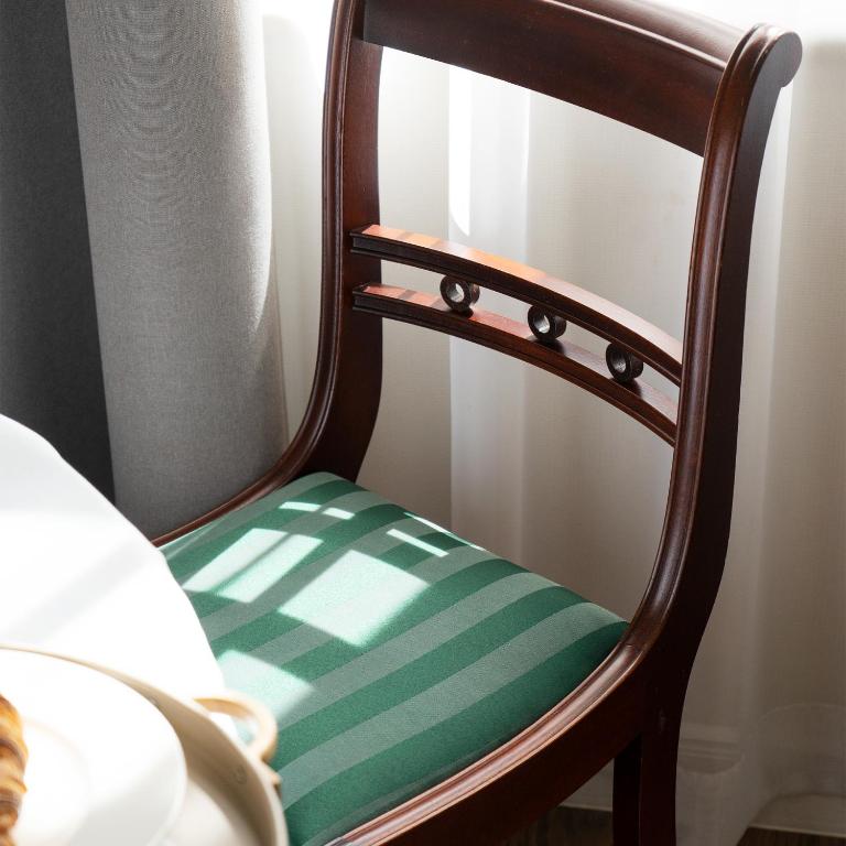 Postel nebo postele na pokoji v ubytování TIFLIS OPERA Aparthotel