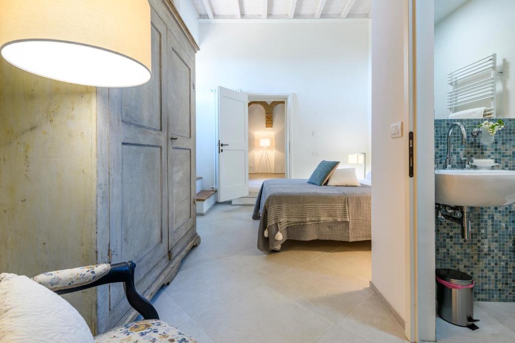 Postel nebo postele na pokoji v ubytování Albergo Diffuso Borgo Santo