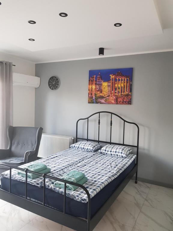 Posteľ alebo postele v izbe v ubytovaní Apartament Malta