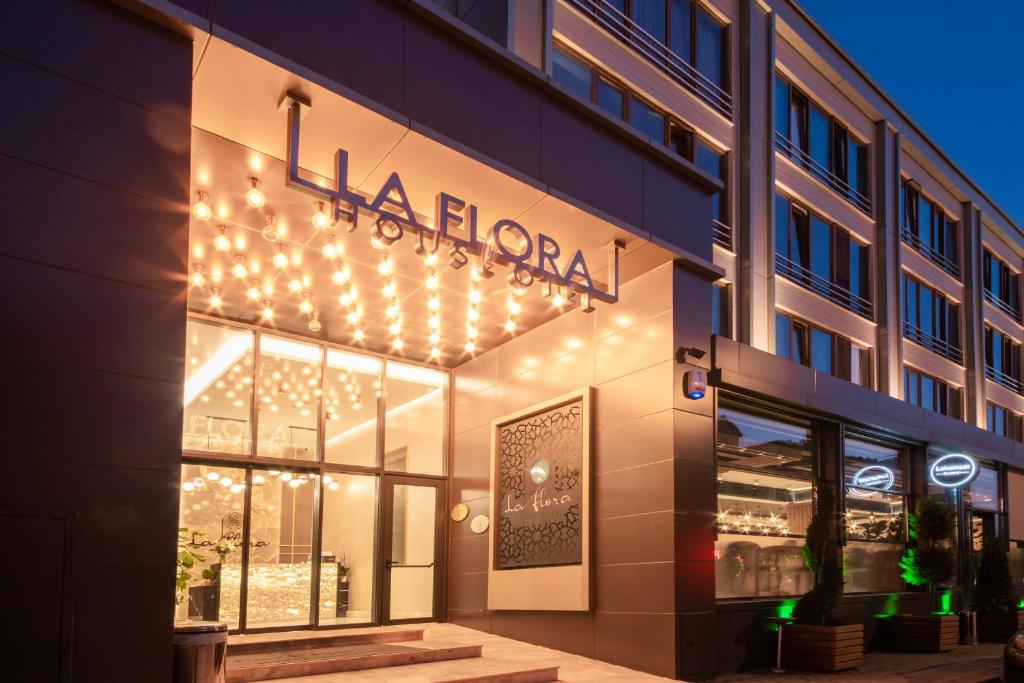 a store front of a building with lights on it at La Flora House Hotel in Kocaeli