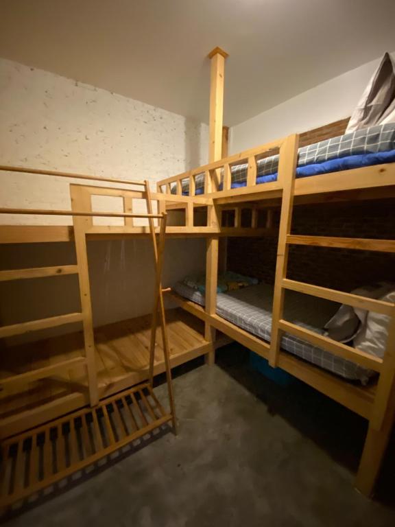 a room with two bunk beds in a room at T-House BKK 2Floors near BTS with swimming pool and free Wifi in Klong Toi