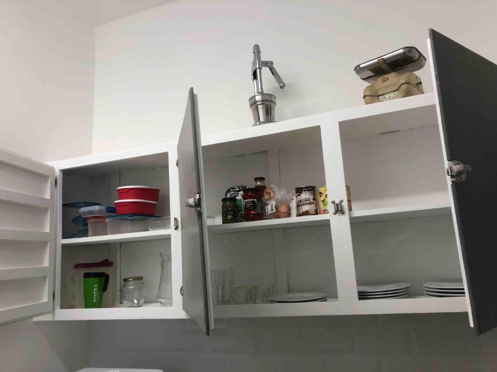 a kitchen with white shelves and a sink at Angels Homes-n27, 2ºfloor - Bairro Tipico, Centro Lisboa in Lisbon