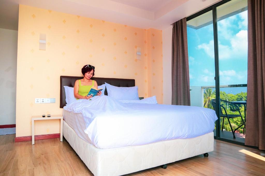 Postel nebo postele na pokoji v ubytování Ari Grand Hotel & Spa