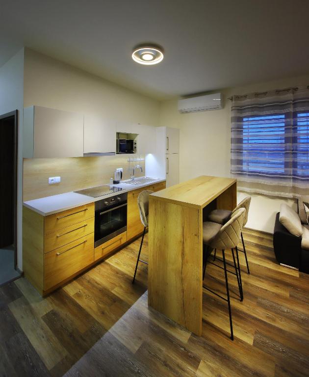 Kuchyň nebo kuchyňský kout v ubytování Apartmány Aswa