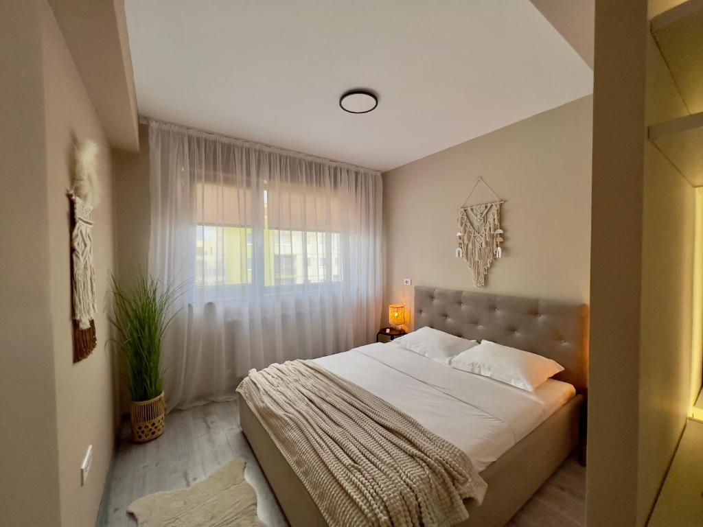 Postel nebo postele na pokoji v ubytování Boholand Apartment