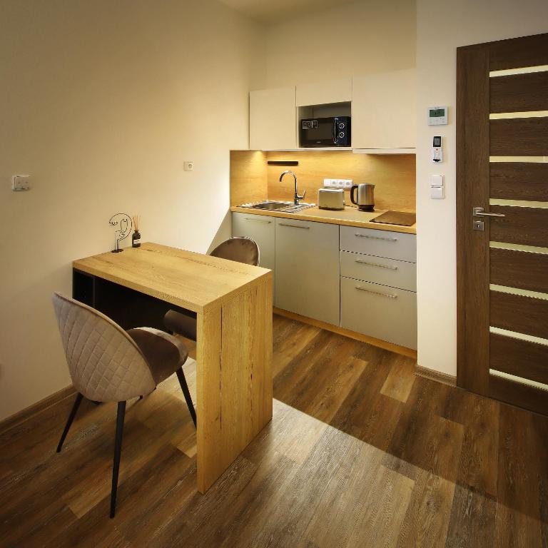 Kuchyň nebo kuchyňský kout v ubytování Apartmány Aswa
