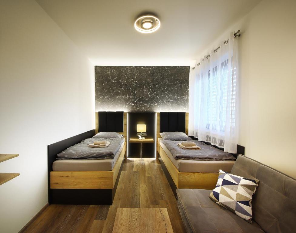 Postel nebo postele na pokoji v ubytování Apartmány Aswa