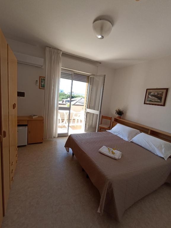 Postel nebo postele na pokoji v ubytování HOTEL LA PLAYA
