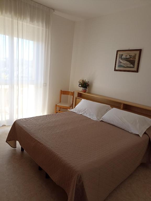 Postel nebo postele na pokoji v ubytování HOTEL LA PLAYA