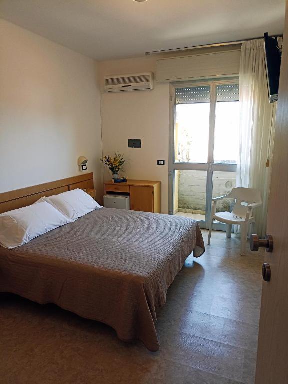 Postel nebo postele na pokoji v ubytování HOTEL LA PLAYA