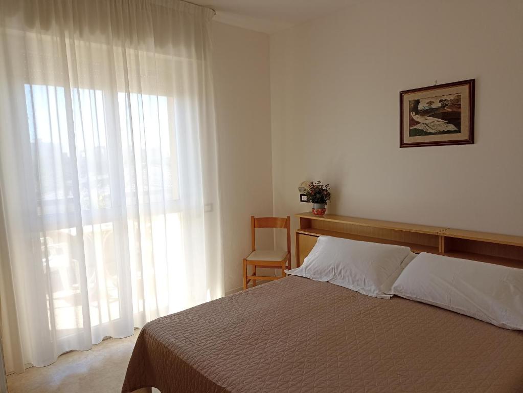 Postel nebo postele na pokoji v ubytování HOTEL LA PLAYA