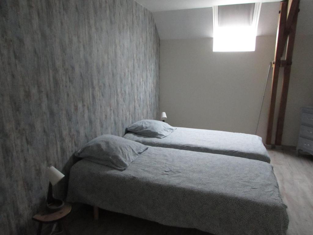 Posteľ alebo postele v izbe v ubytovaní Gîte T'ché Dédée