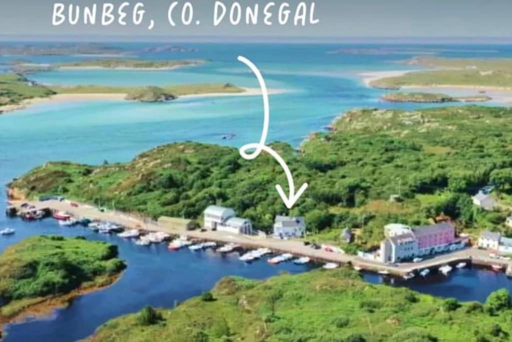 an aerial view of a bridge over a body of water at The Old Boathouse at Bunbeg Harbour in Bunbeg