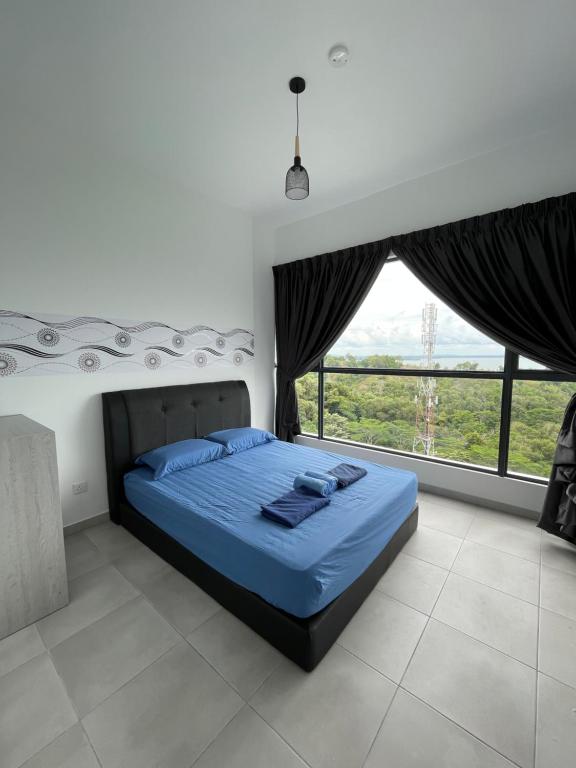 a bedroom with a bed and a large window at Sandakan Homestay Sea-Forest View Apartment 2R2B 海森雙景公寓 in Sandakan