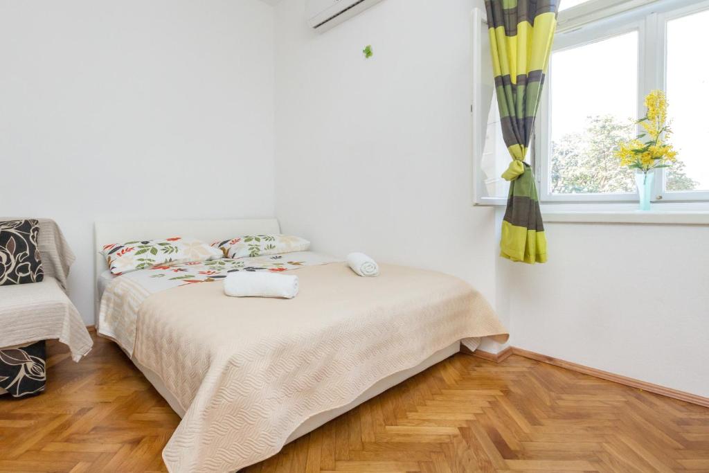Postel nebo postele na pokoji v ubytování Central Jardin Guest House Split