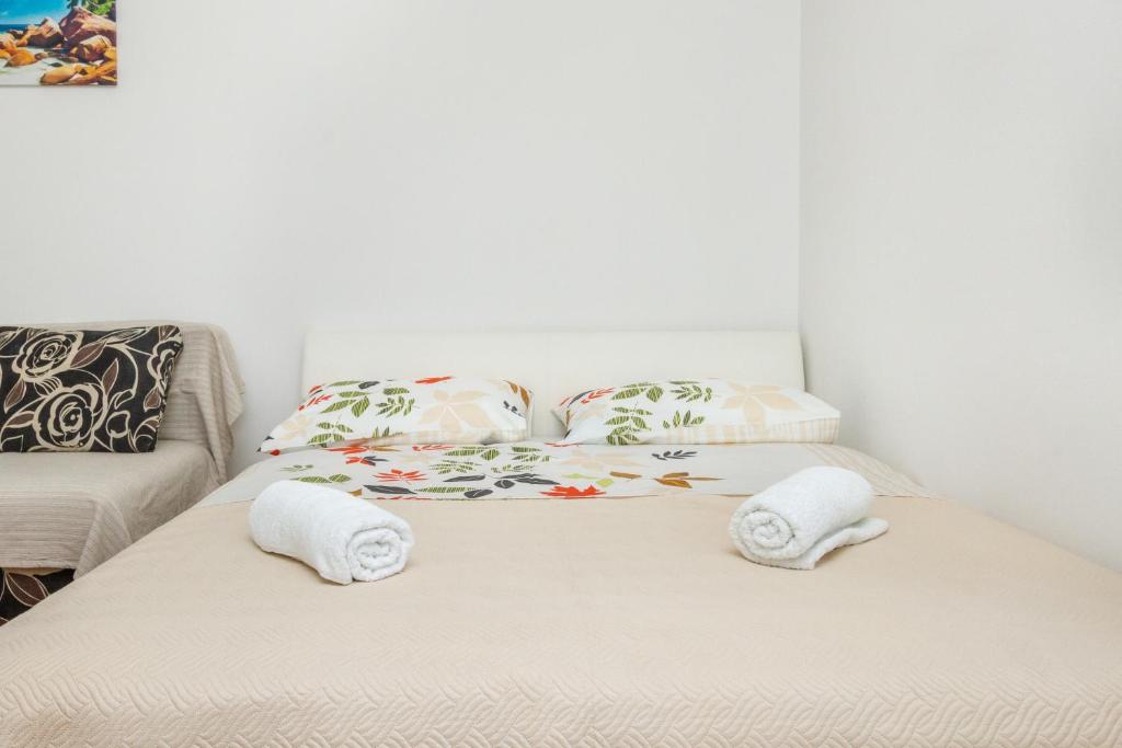 Postel nebo postele na pokoji v ubytování Central Jardin Guest House Split