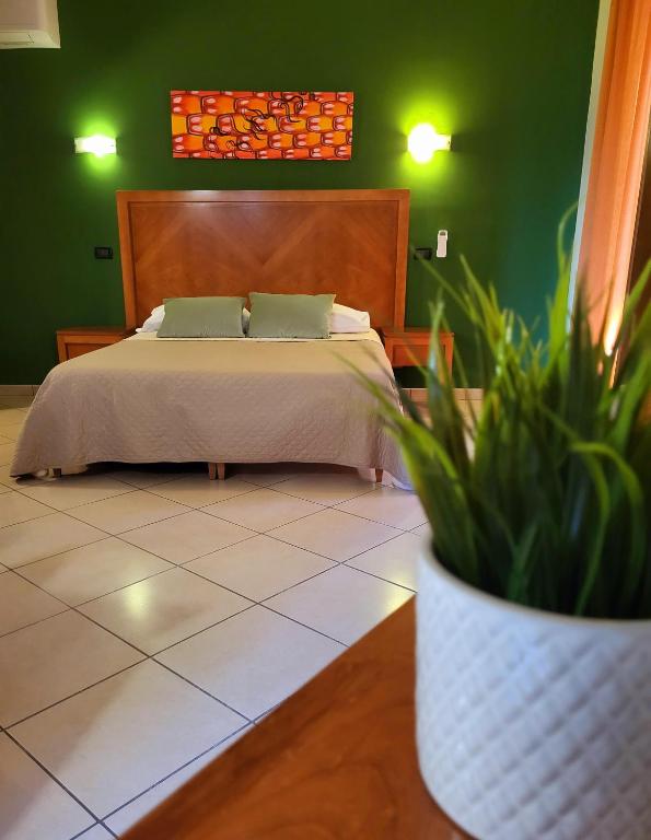 Postel nebo postele na pokoji v ubytování Hotel Federico II