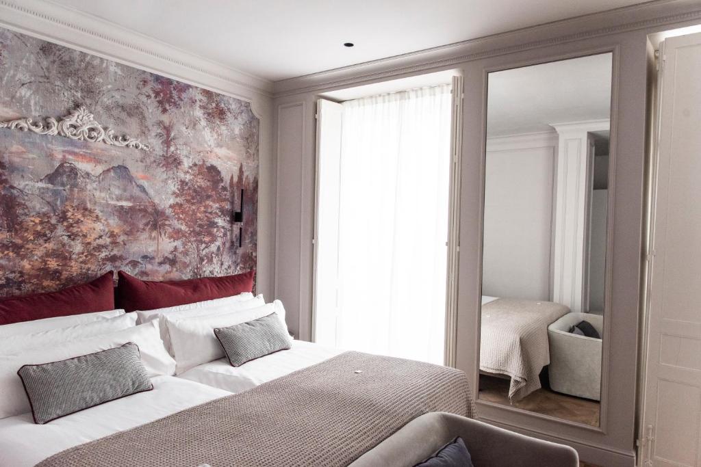 Postel nebo postele na pokoji v ubytování Soho Boutique Palacio de Pombo