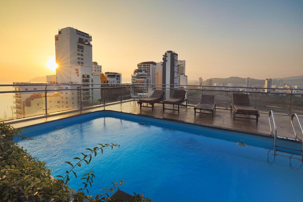 a swimming pool on the roof of a building at An Vista Hotel in Nha Trang