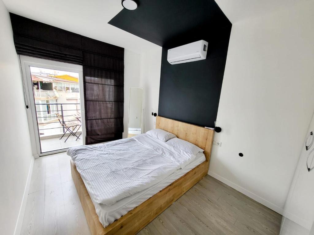 Postel nebo postele na pokoji v ubytování Уютные апартаменты, квартира в аренду Анталия, Лара