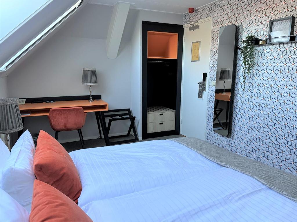 Postel nebo postele na pokoji v ubytování Hotel Op Diek