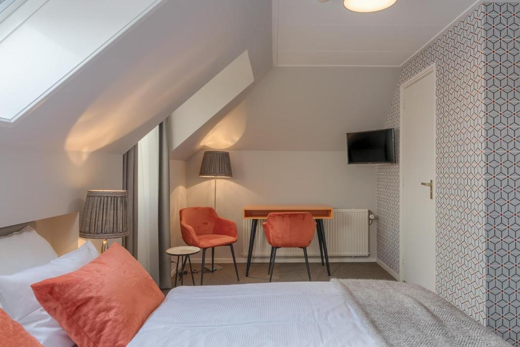 Postel nebo postele na pokoji v ubytování Hotel Op Diek